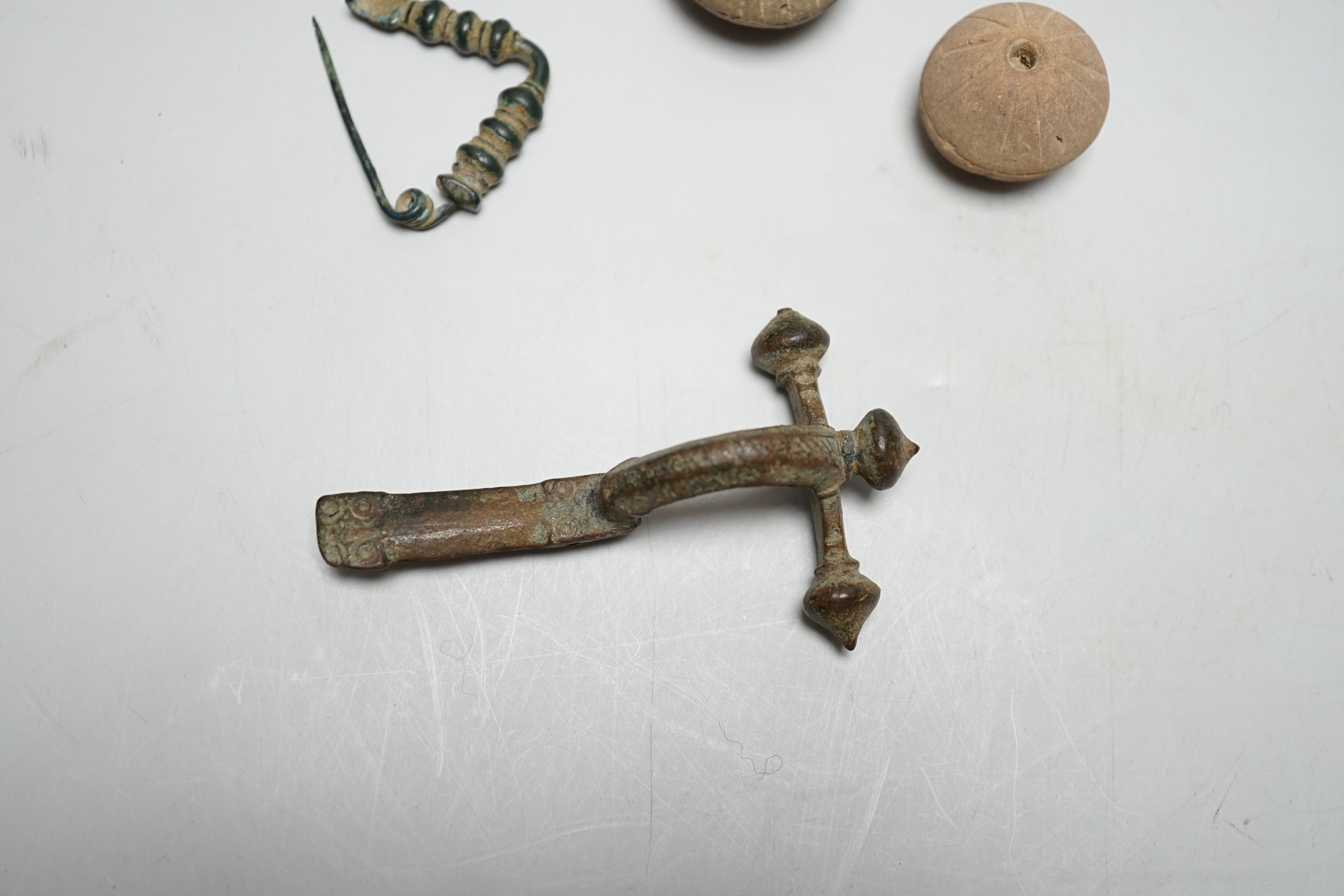 A collection of ancient bronze and terracotta items